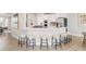 Modern kitchen with a long breakfast bar and stainless steel appliances at 14850 Akron St, Brighton, CO 80602