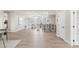 An open living area showcases stylish furniture, a fireplace, and ample space with a staircase nearby at 14850 Akron St, Brighton, CO 80602