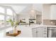 Open-concept view showcasing a living room with a fireplace and kitchen island at 14850 Akron St, Brighton, CO 80602