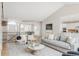 Open-concept living room with a staircase, dining area, and kitchen in view at 14850 Akron St, Brighton, CO 80602