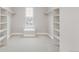 Spacious walk-in closet with built-in shelving units, offering ample storage space at 14850 Akron St, Brighton, CO 80602