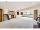 Spacious basement with carpet, stairs, and windows for natural light at 10020 Bryant St, Denver, CO 80260