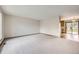 Bright living room with neutral carpet and large windows offering plenty of natural light at 10020 Bryant St, Denver, CO 80260