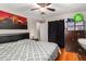 Bedroom showcasing hardwood floors, a ceiling fan, and a neutral color scheme, creating a relaxing space at 2612 Meadowbrook Dr, Denver, CO 80221