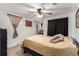 Bedroom featuring a ceiling fan, natural light, and closet for storage at 2612 Meadowbrook Dr, Denver, CO 80221