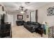 Spacious living room with carpet flooring, ceiling fan, and comfortable seating at 2612 Meadowbrook Dr, Denver, CO 80221