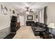Spacious living room with carpet flooring, ceiling fan, and comfortable seating at 2612 Meadowbrook Dr, Denver, CO 80221