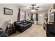 Spacious living room with carpet flooring, ceiling fan, and comfortable seating at 2612 Meadowbrook Dr, Denver, CO 80221
