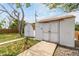 Two white sheds, both with a brown roof, nestled in the backyard at 2612 Meadowbrook Dr, Denver, CO 80221