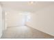 Finished carpeted basement features neutral walls and a window at 1145 S Boston St, Denver, CO 80247