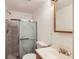 Nicely appointed bathroom featuring a sliding shower door, wood vanity, and modern fixtures at 1145 S Boston St, Denver, CO 80247
