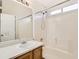 Full bathroom featuring a shower and bathtub combo with a single sink vanity at 1145 S Boston St, Denver, CO 80247