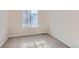 Cozy bedroom with new carpet, a large window, and natural light at 1145 S Boston St, Denver, CO 80247