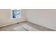 Small bedroom featuring carpet, a window, and neutral-colored walls at 1145 S Boston St, Denver, CO 80247