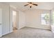 Spacious bedroom featuring new carpet, neutral paint, and a ceiling fan at 1145 S Boston St, Denver, CO 80247