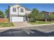 Charming two-story home with a well-maintained lawn and attached two-car garage at 1145 S Boston St, Denver, CO 80247