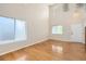 Bright living room with soaring ceilings, hardwood floors, and large windows at 1145 S Boston St, Denver, CO 80247