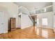 Bright living room with hardwood floors, staircase and large windows at 1145 S Boston St, Denver, CO 80247