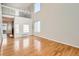 Bright living room with soaring ceilings, hardwood floors, and large windows at 1145 S Boston St, Denver, CO 80247