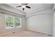 Bright bedroom features neutral colors, plush carpet, and a tray ceiling with fan at 2230 Valentia St, Denver, CO 80238
