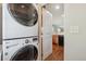 Laundry area with stacked white washer and dryer at 2230 Valentia St, Denver, CO 80238
