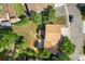 Aerial view of a well-maintained property with a spacious backyard surrounded by mature trees at 6411 W 82Nd Dr, Arvada, CO 80003