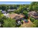 Back yard aerial view of a well-maintained home with mature trees and a storage shed at 6411 W 82Nd Dr, Arvada, CO 80003