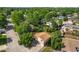 Aerial view of a landscaped home with mature trees in a quiet neighborhood at 6411 W 82Nd Dr, Arvada, CO 80003