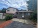 Backyard featuring a patio, lawn, trees, the house and a storage shed at 6411 W 82Nd Dr, Arvada, CO 80003
