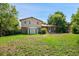 Lush backyard with mature trees and a shed for extra storage and brick accents at 6411 W 82Nd Dr, Arvada, CO 80003