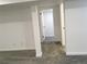 Finished basement showcasing neutral carpeting and white trim throughout at 6411 W 82Nd Dr, Arvada, CO 80003