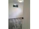 Finished basement with a small window, painted walls, and gray carpeting at 6411 W 82Nd Dr, Arvada, CO 80003