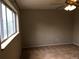Bedroom features a large window, neutral walls and carpeted floor creating a relaxing space at 6411 W 82Nd Dr, Arvada, CO 80003