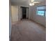 Bedroom with gray walls, carpet, ceiling fan, closet, window and baseboard heater at 6411 W 82Nd Dr, Arvada, CO 80003