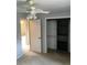 Bedroom with gray walls, carpet, ceiling fan, and closet with a built-in organizer at 6411 W 82Nd Dr, Arvada, CO 80003