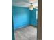 Cozy bedroom with blue walls, plush carpeting, natural light, and a ceiling fan at 6411 W 82Nd Dr, Arvada, CO 80003