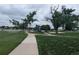 A beautifully maintained community park features walking paths, mature trees, and a playground at 6411 W 82Nd Dr, Arvada, CO 80003