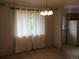 Cozy dining area featuring natural light and vintage chandelier at 6411 W 82Nd Dr, Arvada, CO 80003