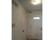 Bright entryway featuring a classic white door with a decorative glass insert at 6411 W 82Nd Dr, Arvada, CO 80003