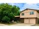 Charming two-story home with a brick facade and an attached two-car garage at 6411 W 82Nd Dr, Arvada, CO 80003