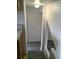 Hallway featuring wood-look flooring, white walls, and a classic flush mount light fixture at 6411 W 82Nd Dr, Arvada, CO 80003