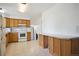 Spacious kitchen with wood cabinets, white appliances and plenty of counter space at 6411 W 82Nd Dr, Arvada, CO 80003
