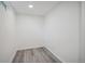Cozy room with wood-look floors and a bright, clean interior at 6411 W 82Nd Dr, Arvada, CO 80003