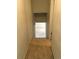 Carpeted stairway leading to the lower level with neutral walls at 6411 W 82Nd Dr, Arvada, CO 80003