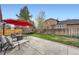 Large backyard with patio, seating, trampoline, and privacy fence at 5255 S Waco St, Centennial, CO 80015