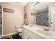 Bathroom featuring double sinks and a decorative cow print shower curtain at 5255 S Waco St, Centennial, CO 80015