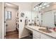 Bathroom with a marble countertop vanity, and a separate shower area at 5255 S Waco St, Centennial, CO 80015