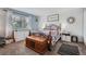 Comfortable bedroom with shiplap accent wall, a queen-sized bed, and stylish decor at 5255 S Waco St, Centennial, CO 80015