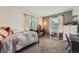 Cozy bedroom with soft carpet, natural light, and a charming vanity area at 5255 S Waco St, Centennial, CO 80015