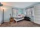 Comfortable bedroom with ample natural light, guitar, and built-in shelving at 5255 S Waco St, Centennial, CO 80015